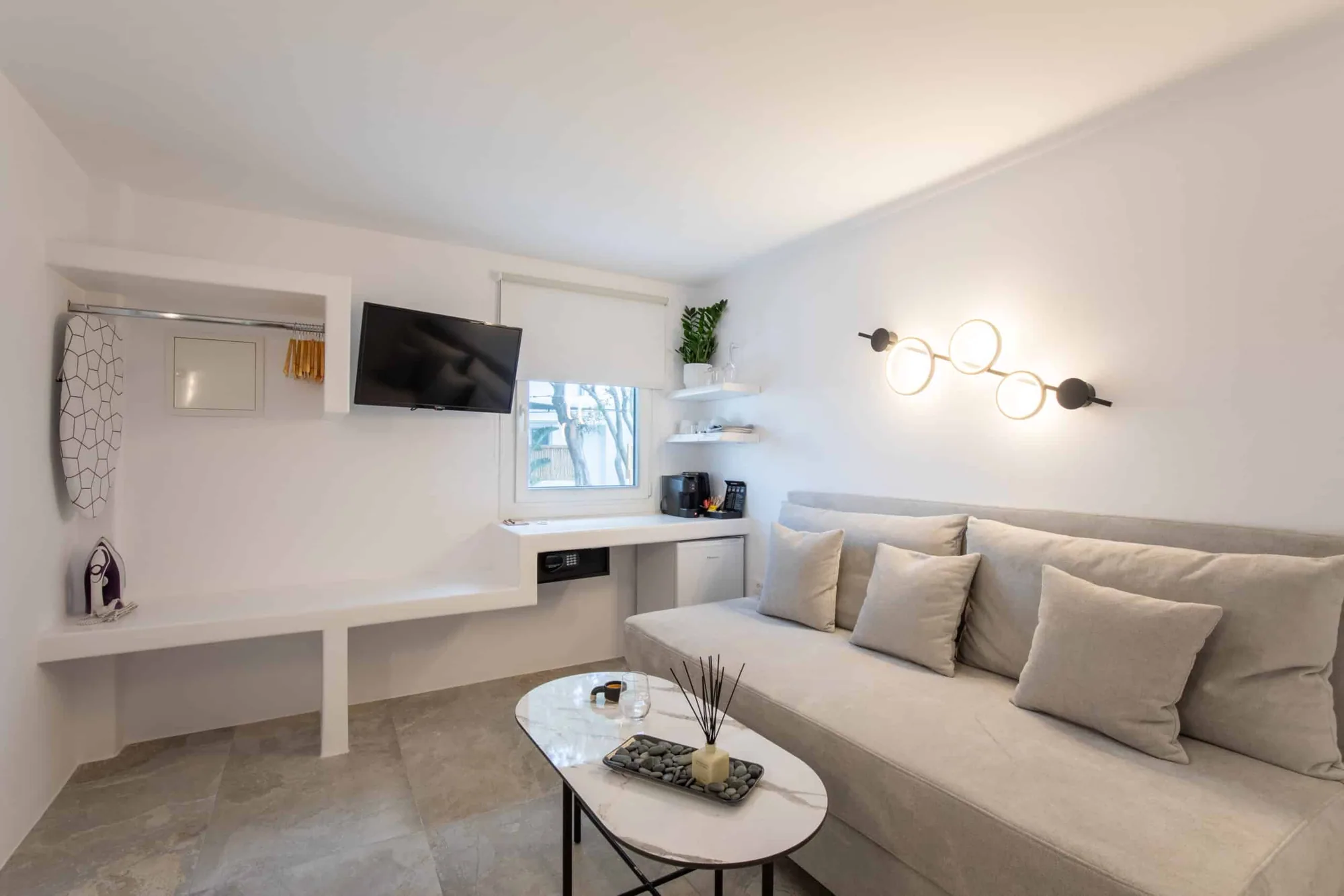 Standard Studio · Single sofa bed beneath a ring lamp